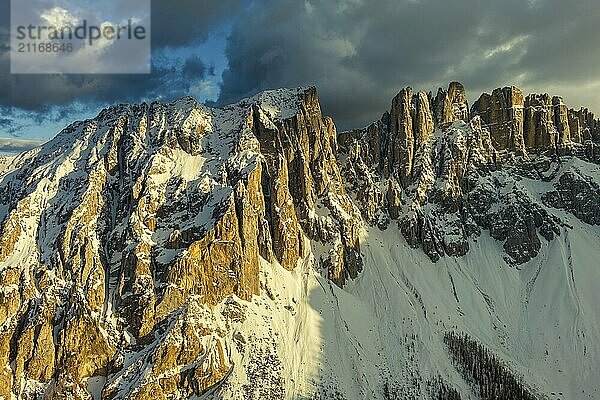 Aerial view of amazing rocky mountains in snow at sunset  Dolomites  Italy  Europe