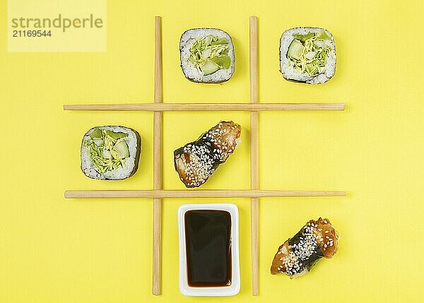 Food  Creative Arrangement of Sushi and Sashimi on Yellow Background for Japanese Cuisine Concept