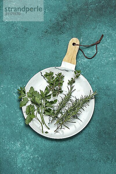 Food  Food  Fresh herbs on white  blue background. Top view