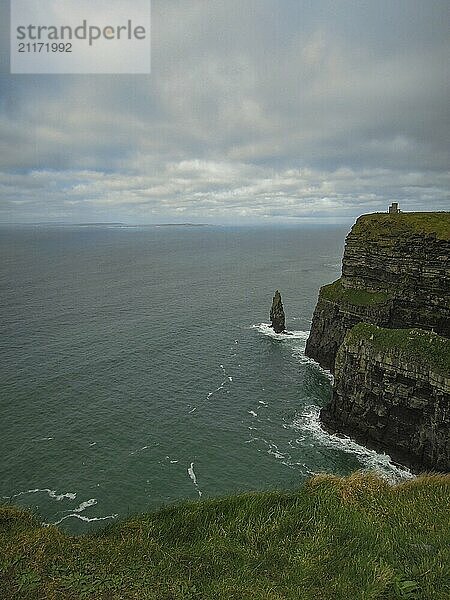 Dark cliff view at dusk  with a gloomy sea crashing against the cliff faces  North Sea  Ireland  Europe