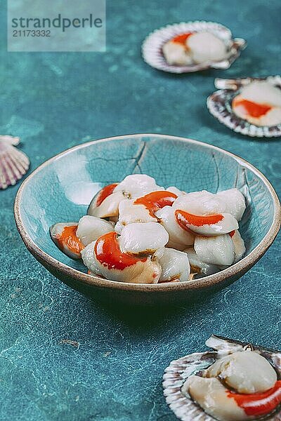 Food  Food  Raw fresh seafood shellfish scallops on blue background