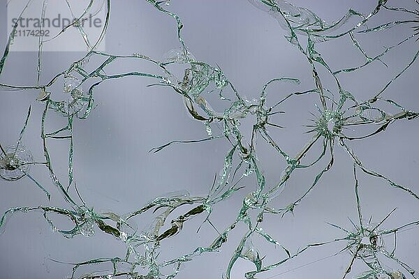 Cracked glass  texture of broken shots of glass on a white background