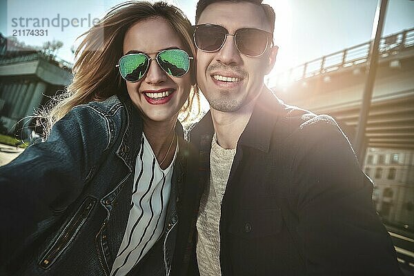 Happy young couple in love takes selfie portrait