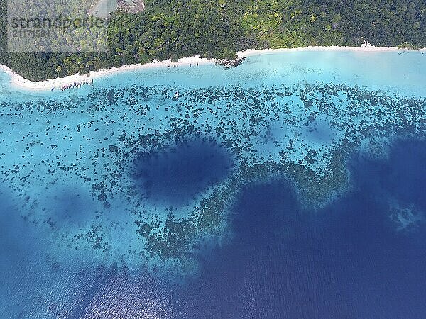 Top aerial view from flying drone of beauty nature landscape with tropical beach with boats and sea in Thailand