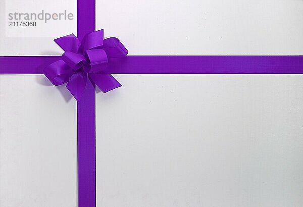 Purple ribbon on a white background