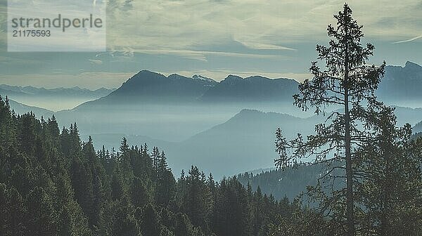 Aerial view of smoky mountains under mist in the morning. Amazing nature scenery in Dolomites  Italy. Tourism and travel concept