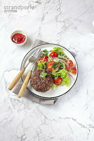 Food  Food  Beef hamburger with lettuce tomato salad on white plate  top view