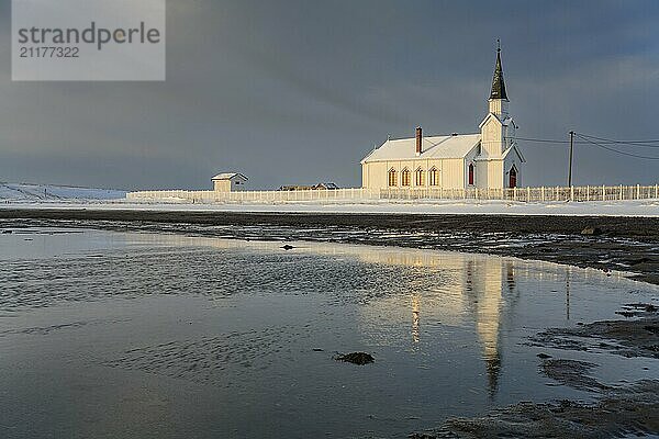 Church in the morning light  cloudy mood  beach  sea  winter  Nesseby Church  Varanger Peninsula  Norway  Europe