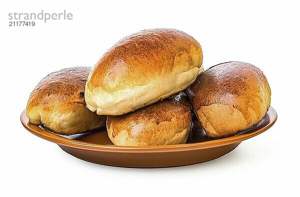 Puffy pies on brown plate isolated on a white background