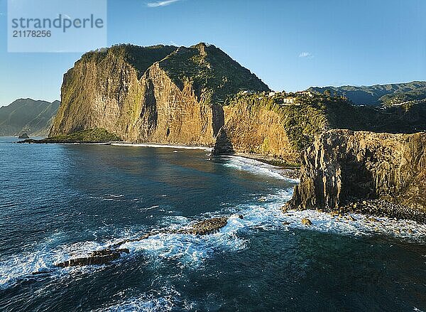 Aerial view of Madeira cliffs coastline landscape on sunrise  Guindaste viewpoint  Madeira island  Portugal  Europe