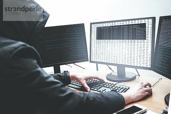 Hack concept. Picture of male hacker trying to steal information from system while looking at computer  isolated on white background