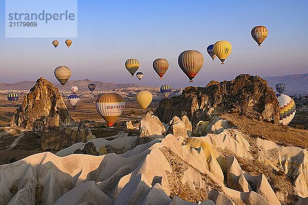 Flying hot air balloons and rock landscape at sunrise time in Goreme  Cappadocia  Turkey  Asia