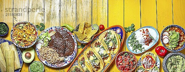 Food  Food  Mexican festive food for independence day  independencia chiles en nogada  tacos al pastor  chalupas pozole  tamales  chicken with mole poblano sauce. Yellow background