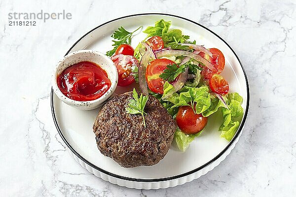 Food  Food  Beef hamburger with lettuce tomato salad on white plate  top view