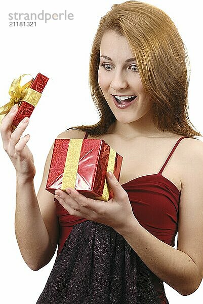 Happy teenage girl with gift box over white background