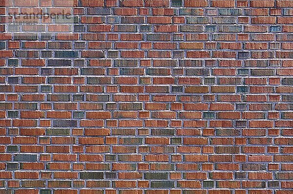 Detailed view of a brick wall with red and brown bricks forming a regular pattern  Bergen  Vestland  Norway  Europe