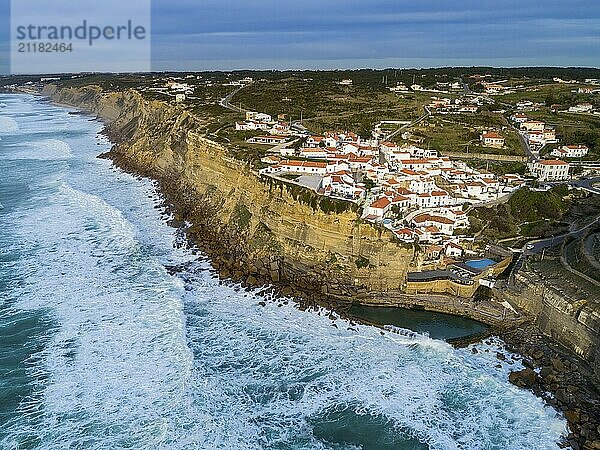 Aerial view of beautiful coastal town Azenhas do Mar in Portugal. The picturesque town on the Atlantic ocean at sunset