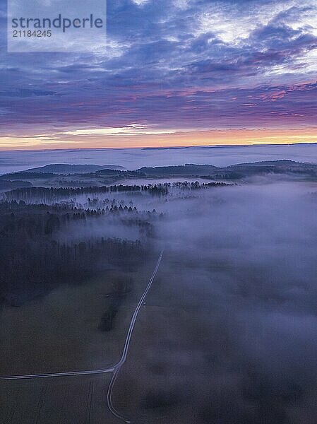 View of a misty landscape with wide fields  hills and enchanting morning sky  Calw  Black Forest  Germany  Europe