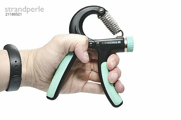 Hand squeezing and gripping hand-grip  strength force  fitness  healthy lifestyle concept on white background  close up selective focus