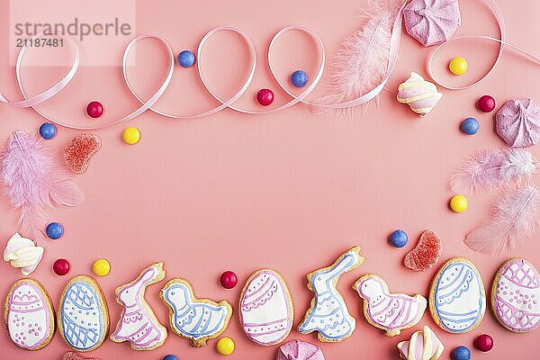 Homemade Easter cookies on pink background flat top view