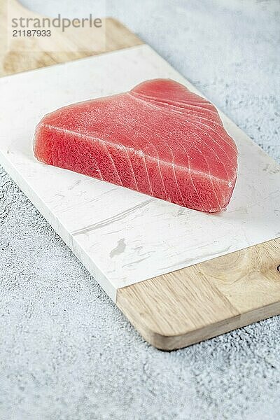 Food  Food  Raw tuna steak on white concrete background