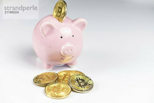 Pink Piggy bank with Bitcoin coin on white background