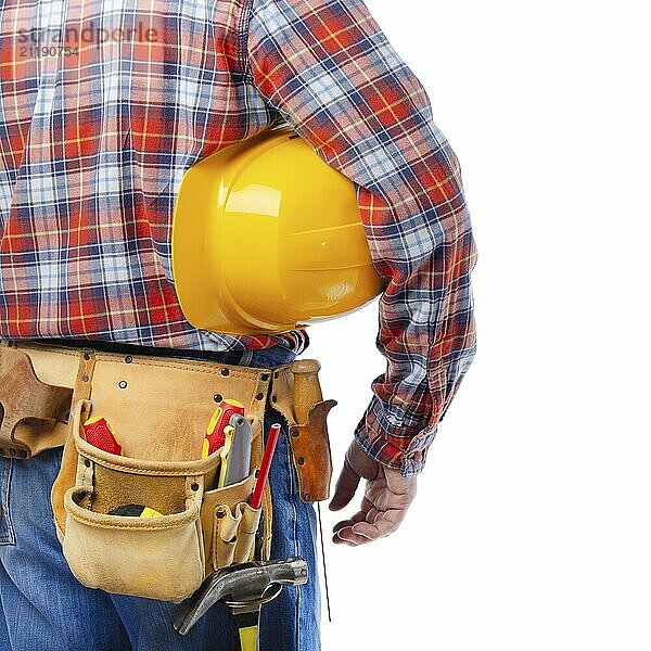 Caucasian contractor with tool belt holds yellow hard hat under his hand on white background. Clipping path added