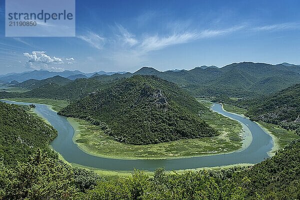 Aerial view of Rijeka Crnojevica  beautiful river between mountains flowing into Skadar Lake  Montenegro  Europe