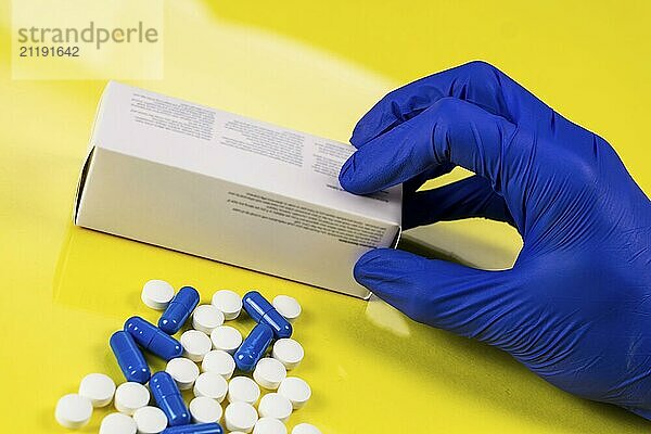 Medicines and pills on yellow background