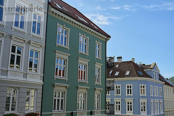 Multi-storey building with historic looking balconies and windows under a slightly cloudy sky  Bergen  Vestland  Norway  Europe