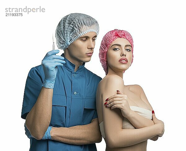 Handsome plastic surgeon with his female pretty patient isolated cropped view on white background