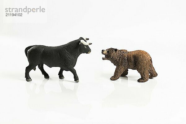 Stock market  securities trading and capitalism concept with a bull and bear concepts. On white background for cutout and copy space