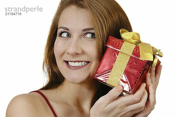 Happy teenage girl with gift box over white background