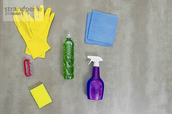 Great concept of cleaning  various products used in cleaning on gray background