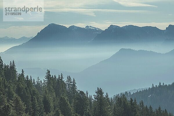 Aerial view of smoky mountains under mist in the morning. Amazing nature scenery in Dolomites  Italy. Tourism and travel concept