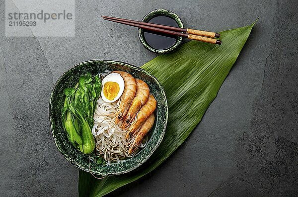 Food  Asian rice noodles with shrimps on gray background