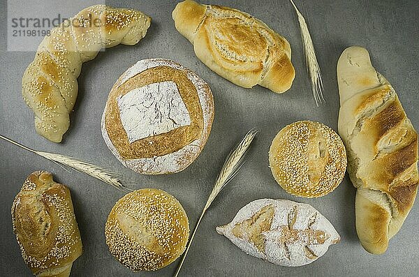 Beautiful Sourdough bread on gray background with dried wheat flower