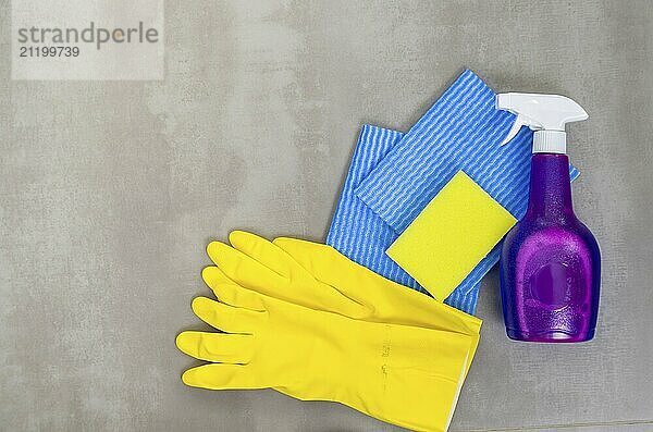 Great concept of cleaning  various products used in cleaning on gray background