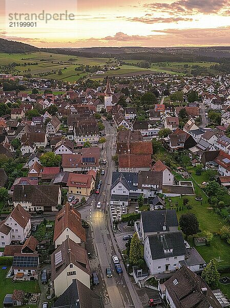 Bird's eye view of village at sunset  central street  church and many houses  surrounded by green nature  Calw  Black Forest  Germany  Europe