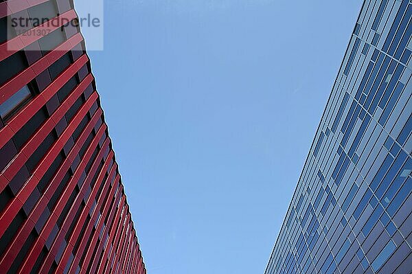 Contrast between a red and a grey modern building against a clear blue sky  Sandnes  Fylke Rogaland  Norway  Europe