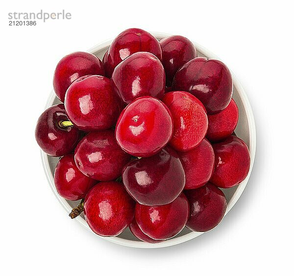 Cherries in bowl isolated on a white background  top view