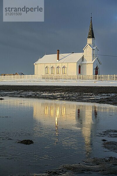 Church in the morning light  cloudy mood  beach  sea  winter  Nesseby Church  Varanger Peninsula  Norway  Europe