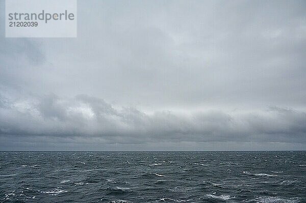 A stormy and turbulent sea under a cloudy grey sky  North Sea  Norway  Europe