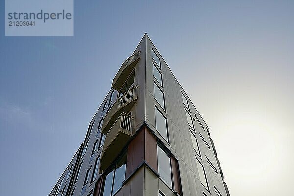 Corner of a modern building with large windows and balconies  sky in the background  Sandnes  Fylke Rogaland  Norway  Europe