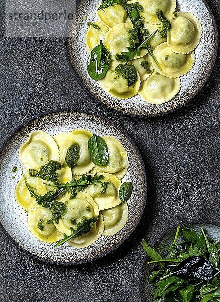 Food  Food  Italian spinach ricotta ravioli  Top view  black background  copy space  Vegetarian food  vegan ravioli