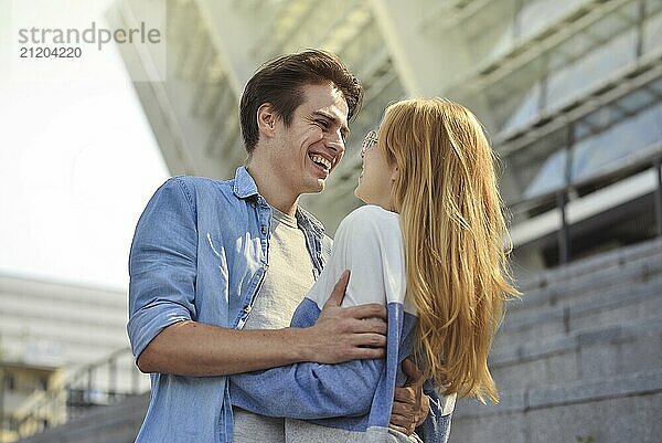 Beautiful couple in love dating outdoors and smiling