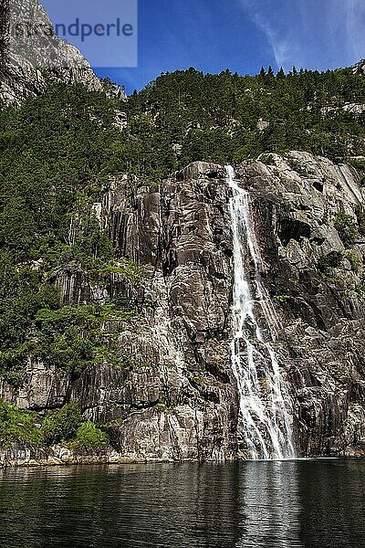 View of a small waterfall over the Lysefjord  a fjord in Norway