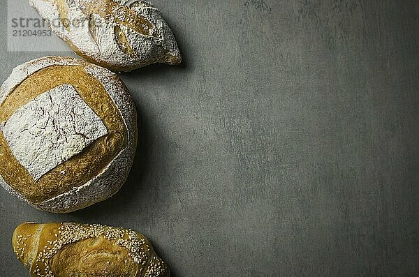 Beautiful Sourdough bread on gray background with dried wheat flower