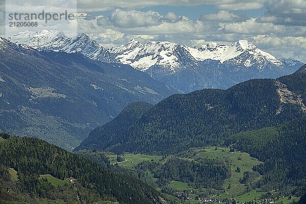 Beautiful top view of high snow-covered mountains and village in Switzerland