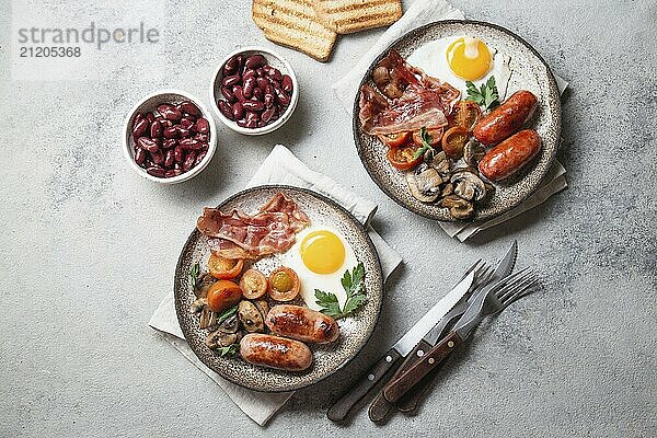 Food  English breakfast on gray plates on white background